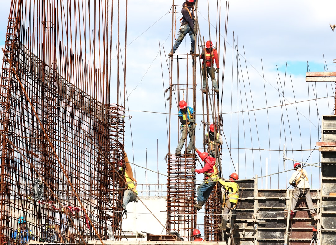 People working on building during daytime